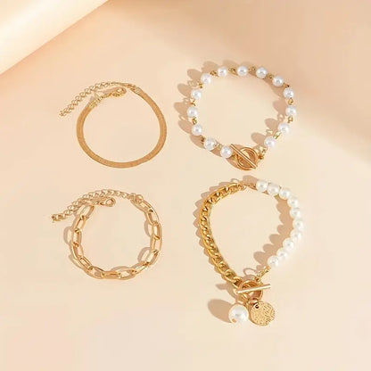 Set di bracciali chic in oro (4 pezzi) – serpente, perle e maglie